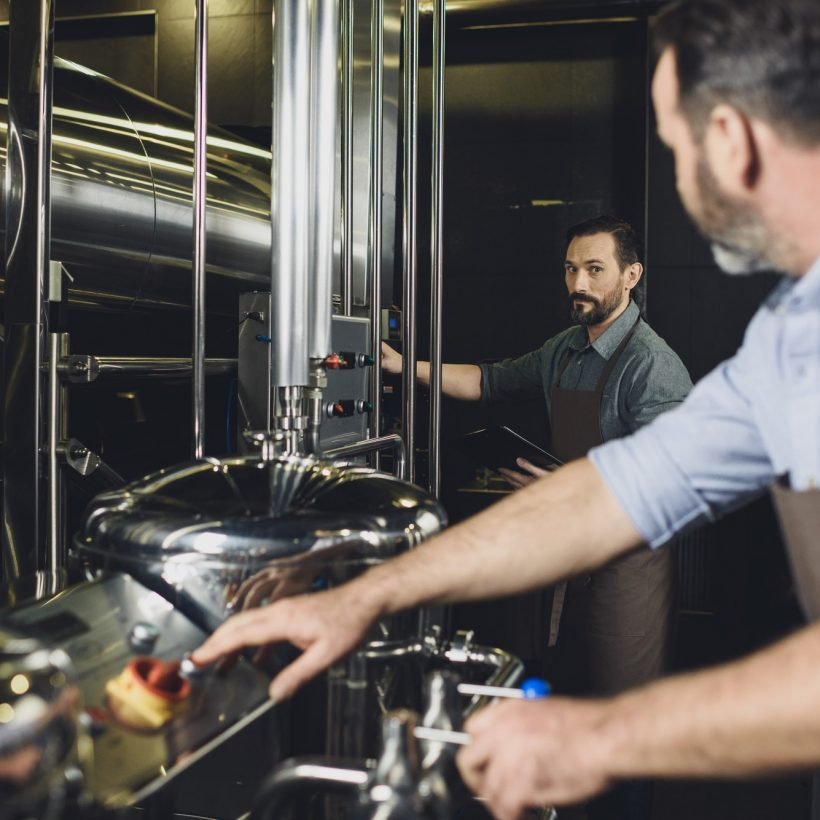 male-brewers-working-with-brewery-equipment.jpg